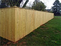 <b>Pressure Treated Vertical Board Privacy Fence with standard black post caps</b>